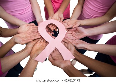 Women in pink outfits standing in a circle on white background for breast cancer awareness - Shutterstock ID 417813493