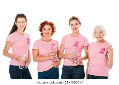 women in pink t-shirts with breast cancer awareness ribbons holding bottles of water and smiling at camera isolated on white  - Powered by Shutterstock