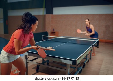 Women play ping pong match, table tennis - Powered by Shutterstock