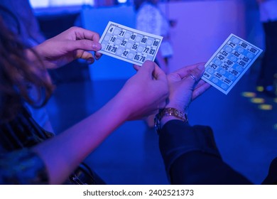 Women playing bingo at night