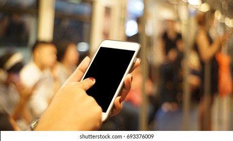 Women Are Playing Phone On Train