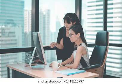 Women Pointing At  Computer, Asian Business Work Office. Group Of Team Business Working Space Environment Corporate. Business People Meeting And Training In Corporate. The Success Business Marketing.