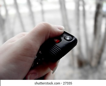 Women Pressing The Button On The Remote Start FOB, To Start The Car