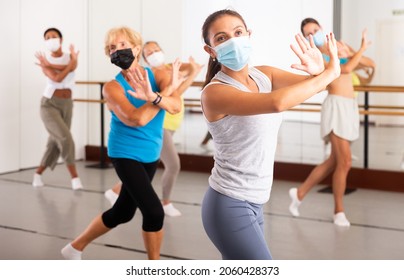 Women In Protective Mask Practicing Vigorous Dance Movements In Group Dance Class