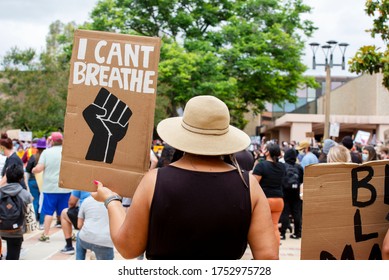 A Women Protester Holds Up An I Can't Breathe Sign. 