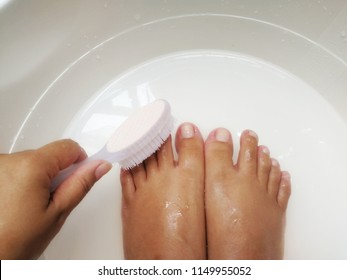 Women put their feet soaked in a bath and polished before cleaning the toenails for good health. - Powered by Shutterstock