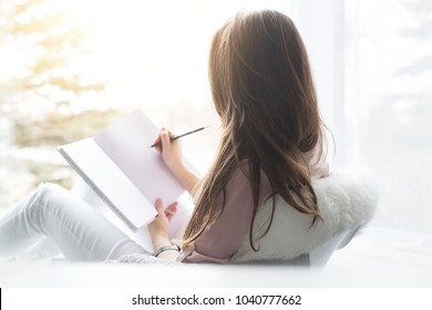 Women Reading And Writing In Journal.