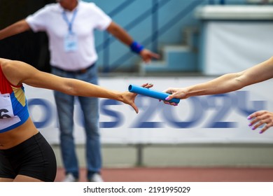 women relay race competition on background banner Sports 2024 - Shutterstock ID 2191995029