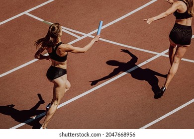 Women Relay Race Running For Track And Field Competition