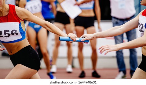 Women Relay Team Passing Of Baton Running 4x400 Meters 