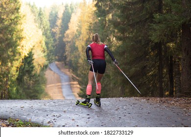Women ride roller skis in the autumn Park.
