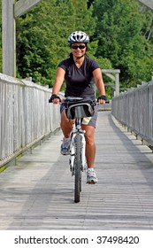 women rider crossing a bridge in Canada