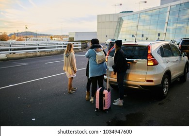 Women Saying Goodbye To Friend At Airport