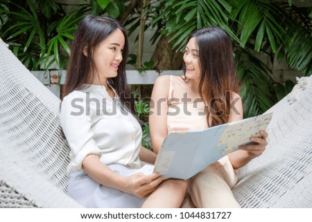 Women searching place for travel by map in vacation time.