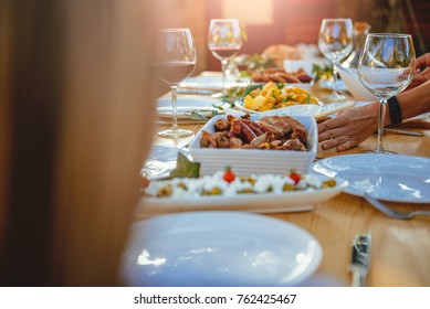 Women Setting Dining Table At Backyard Patio