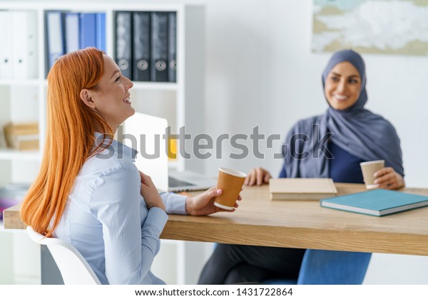 Women Sharing Funny Stories Drinking Coffee Stock Photo Edit Now