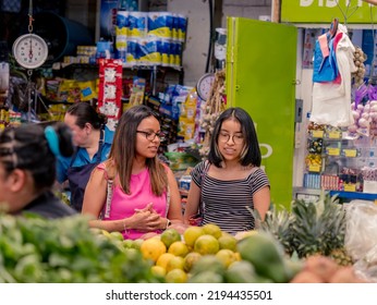 Women Shopping In A Local Market In El Salvador. Hispanic Women.