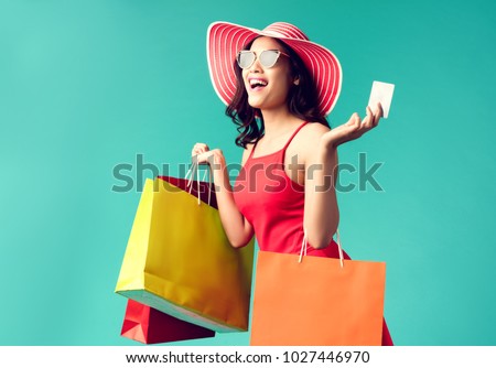 Women are shopping In the summer she is using a credit card and enjoys shopping.