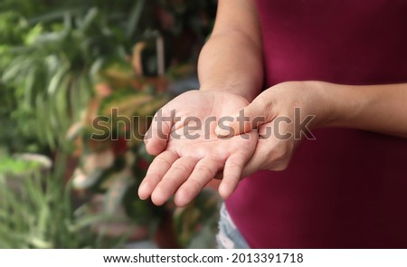 Women show hands pain, numbness, tingling (pins and needles), muscle weakness affected. Signs of neuropathy, stroke, paresthesia, vaccination or Vaccine side effect disease Guillain Barre syndrome,etc