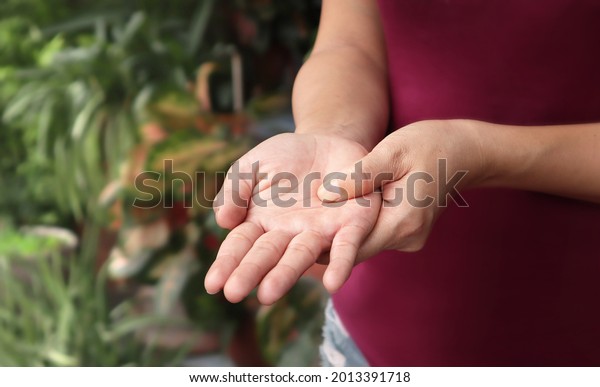 Women show hands pain, numbness, tingling\
(pins and needles), muscle weakness affected. Signs of neuropathy,\
stroke, paresthesia, vaccination or Vaccine side effect disease\
Guillain Barre\
syndrome,etc