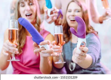 Women Showing Sex Toys They Bought At A Dildo Party And Drinking Champagne