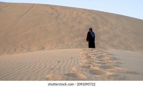 A Women At Singing Sand Dune In Qatar