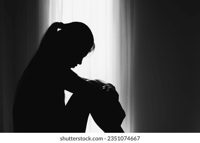  Women sitting on the floor  with depression,  family problems,  Domestic violence, Stop violence and abuse ,sexual abuse, human trafficking,  rape,  The concept of depression and suicide, 