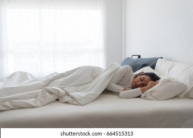 Women Sleep On The Bed