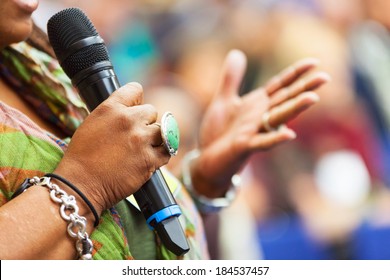 Women Speaking In To The Microphone At The Conference. Detail