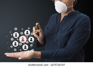 Women spray 70% alcohol on the left hand side To inhibit the virus by the graphic showing the infection Covid-19 from person to person. - Shutterstock ID 1675726747