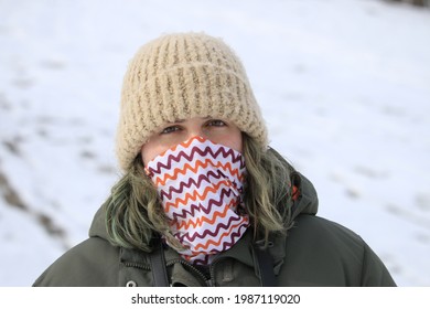 A Women Standing In The Cold Weather Embracing The Canadian Winter 