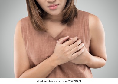 Women Suffering From Chest Pain, Severe Heartache, Having Heart Attack Or Painful Cramps, Pressing On Chest With Painful Expression.