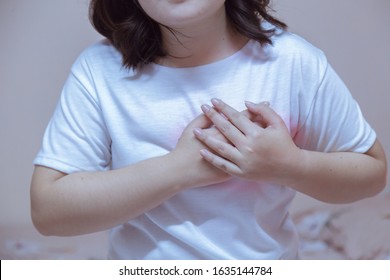 Women suffering from pain in hart oe wrist at home - Shutterstock ID 1635144784