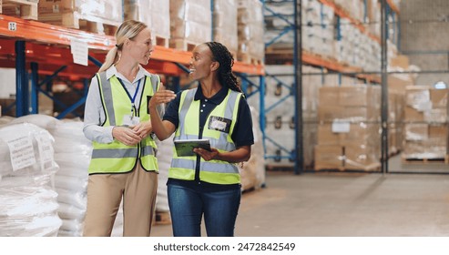 Women, tablet and partner in discussion at warehouse for logistics, cargo and team at global shipping company. People, touchscreen and talk with app for boxes, distribution or supply chain in factory - Powered by Shutterstock