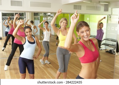 Women Taking Part In Zumba Class In Gym