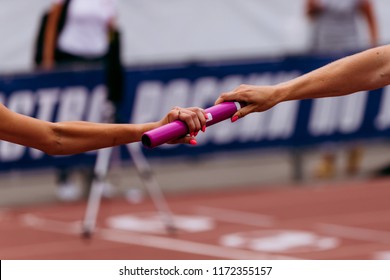 Women Team Relay Race Passing Of Baton On Stage