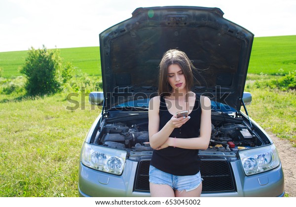 women are telephone calls, insurance and car\
repairman her broken car
