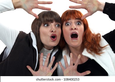 Women With Their Faces Pressed Against Glass