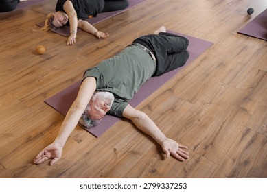 Women three generations doing different yoga exercises lying on back. Women's health of joints and spine
