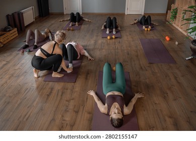 Women three generations doing different yoga exercises lying on back. Women's health of joints and spine
