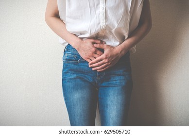 Women Touching Lower Abdomen