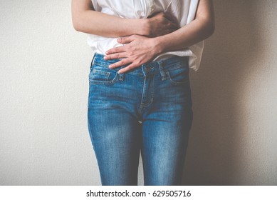 Women Touching Lower Abdomen