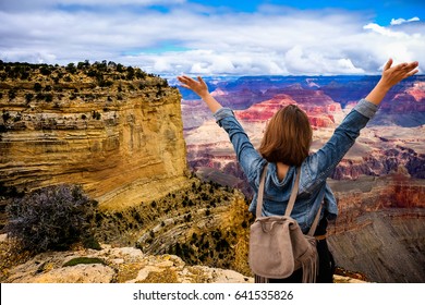 Women tourists wear jacket jeans at sunny light and blue sky at Grand Canyon  National Park , Arizona, USA - Powered by Shutterstock