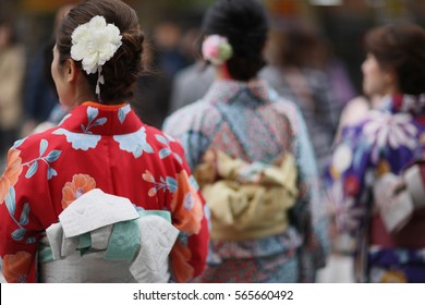 Women In Traditional Clothes Of Kimono On A Street In Tokyo, Japan.