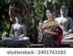  women in traditional clothing  on Buddhist on background.  Portrait women in traditional clothing , Thai traditional  in Ayutthaya, Thailand.