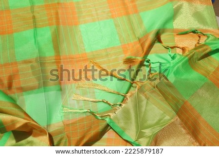 women Traditional Green and Orange Color Handmade Work Saree Isolated on White Background
