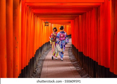Women in traditional japanese kimonos walking at Fushimi Inari Shrine in Kyoto, Japan - Shutterstock ID 550609591