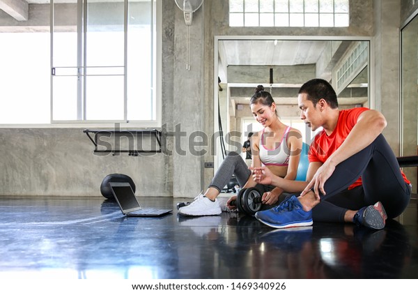 Women Trainers Analyzing Exercise Young Woman Stock Photo