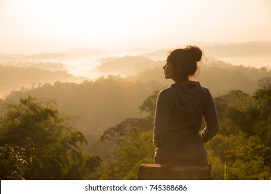 women Travel nature in the mountains,Woman watching the sunrise.