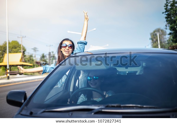 Women travel\
on holiday With a car in the\
morning.